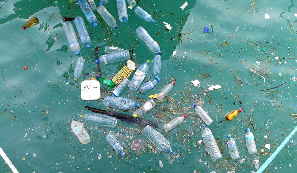 plastic water bottles and other debris floating in the ocean