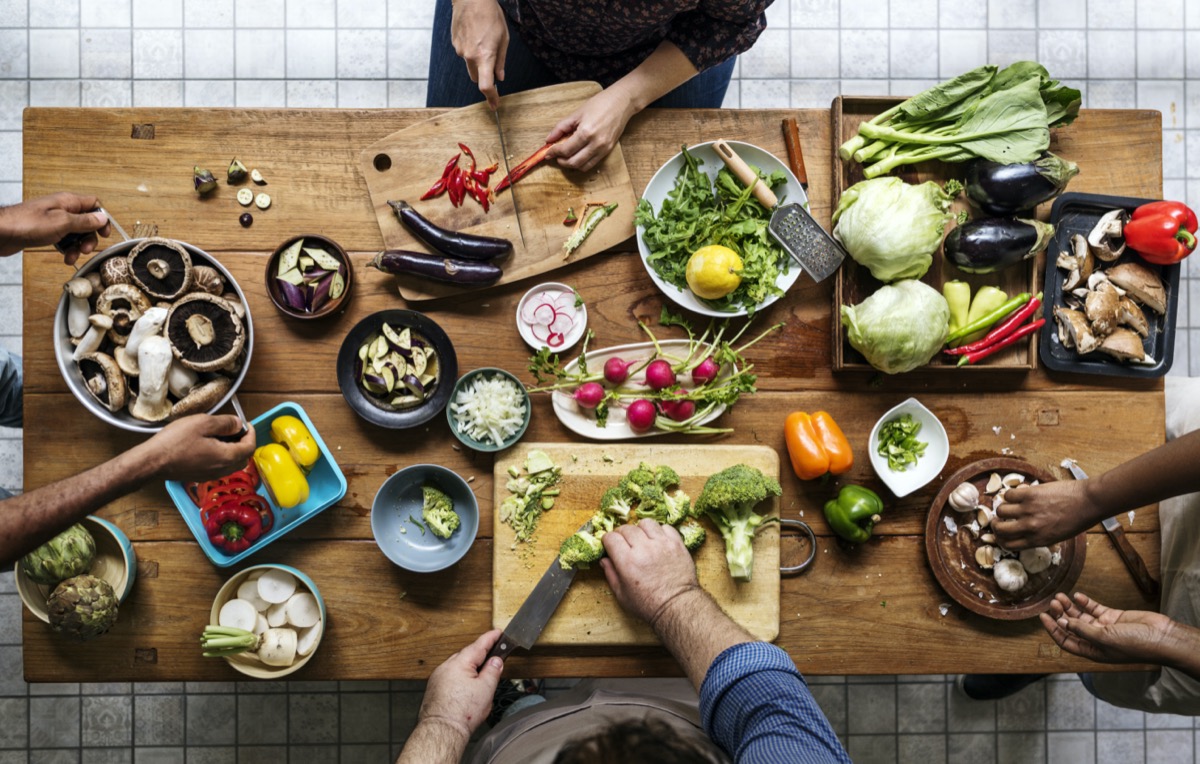 Aerial view of people with fresh vegetables preparing to cook