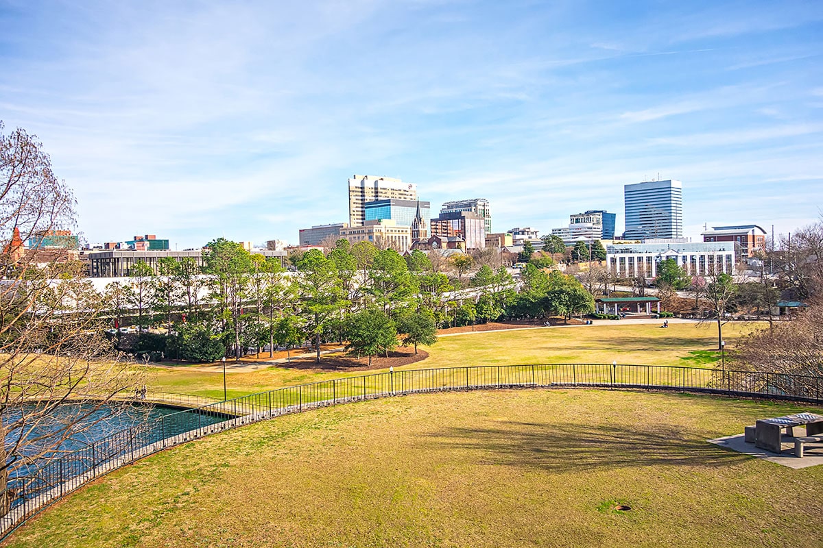 View of the buildings in downtown Columbia, South Carolina from a park.