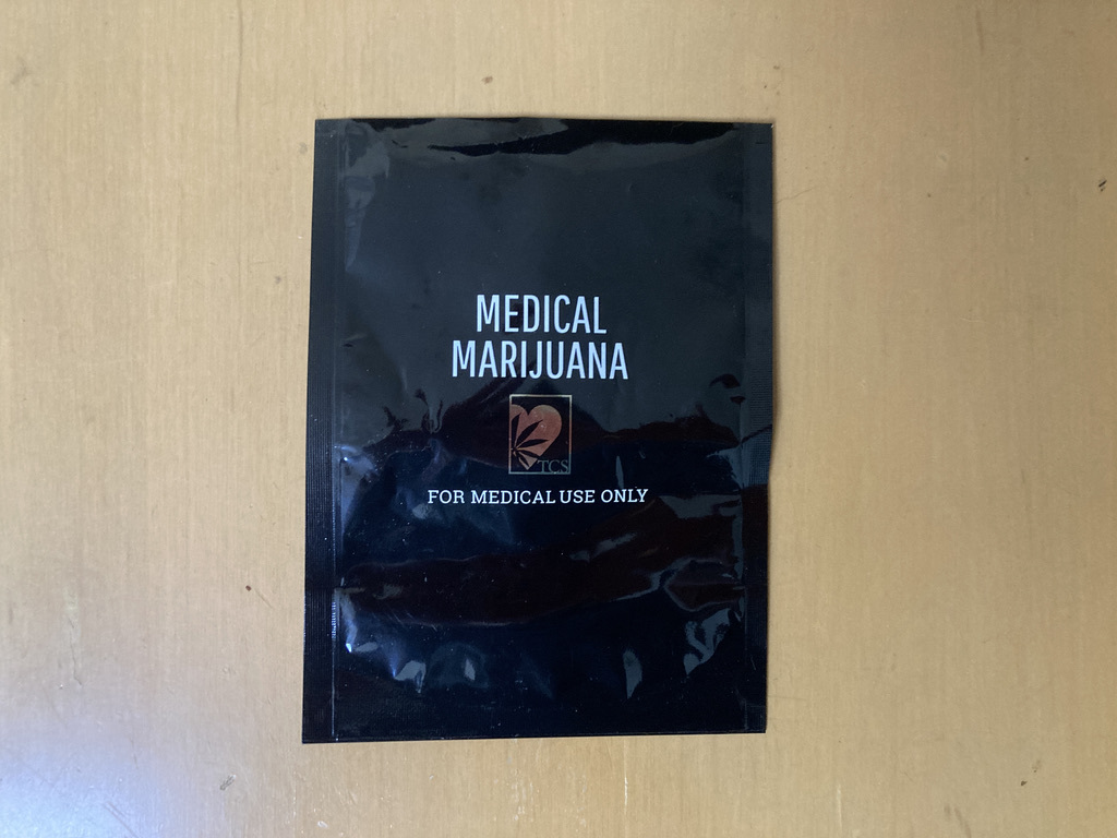 a medical marijuana plastic bag lying on a table