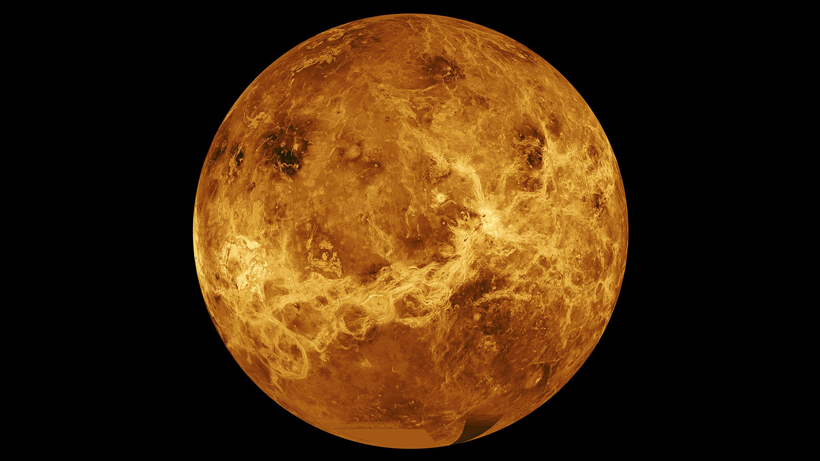 an image of the entire planet of venus, showing craters, and canyons on its surface