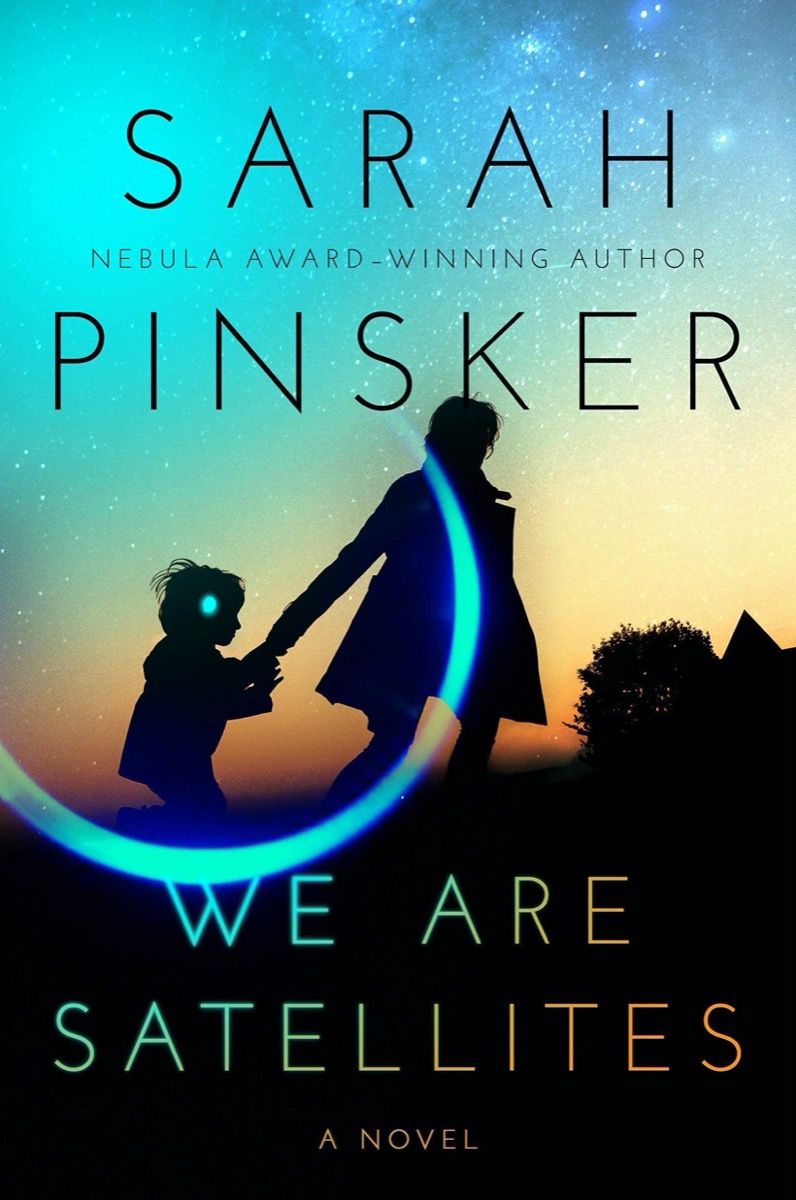 a book cover two shadowed figures of an adult holding a child's hand with a silhouette of a house and a tree in a background. behind is a sunset with stars. there is a reflective circle and dot surrounding the child's head. the title reads "we are satellites" by sarah pinsker.