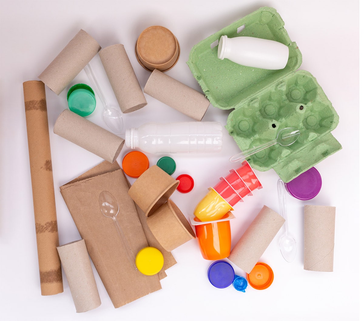 Paper, plastic, and cardboard recyclables in a pile.