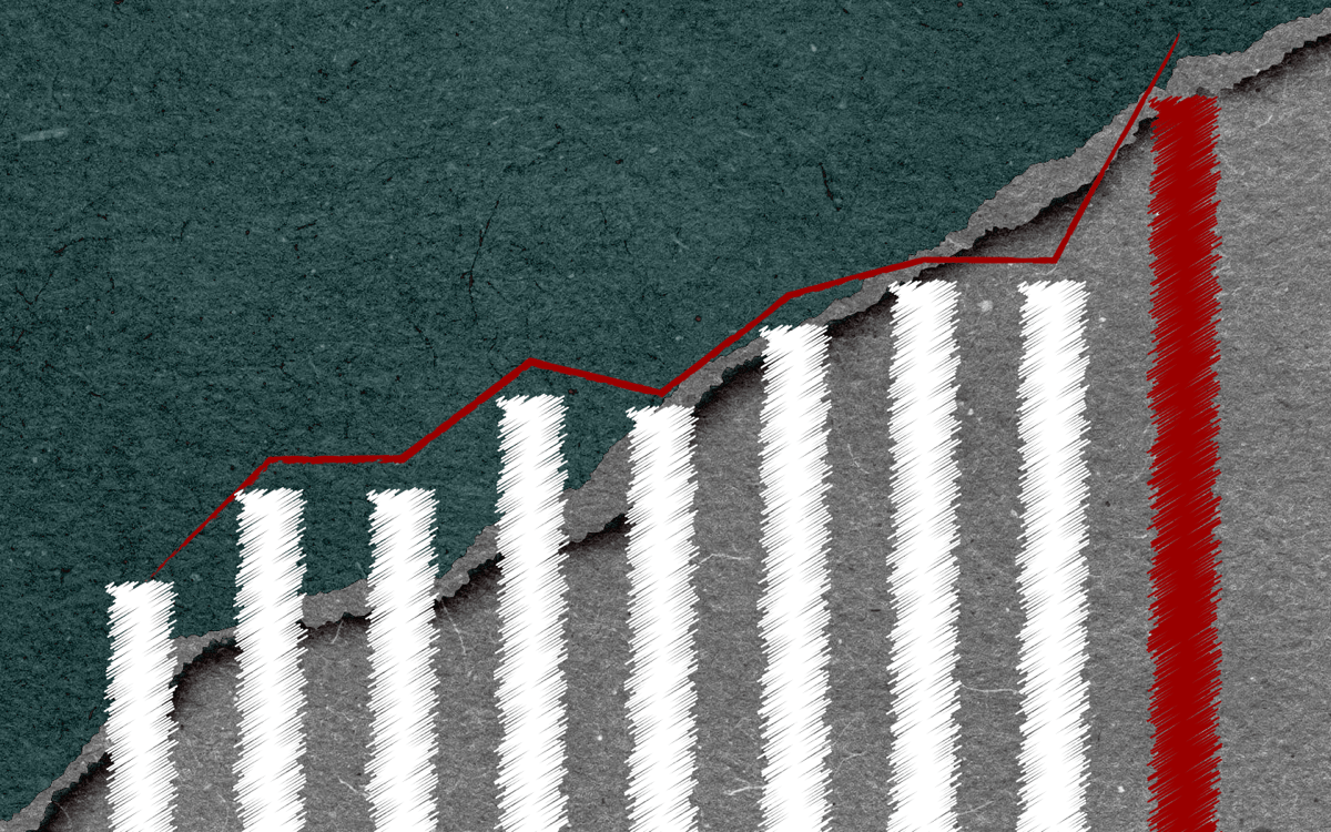 a graphic of a hand drawn bar graph with a red trend line going up. the farthest right bar is colored red. behind the graph is a blue paper torn to reveal gray paper under it