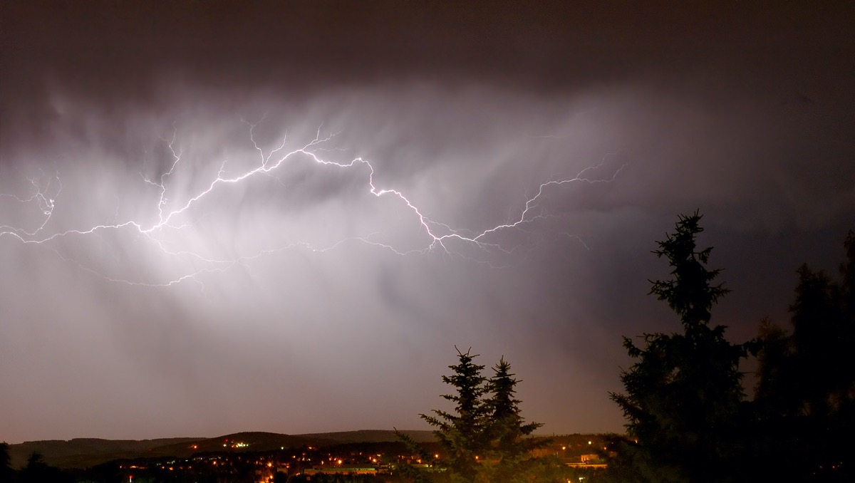 a dark cloud illuminated by lightning