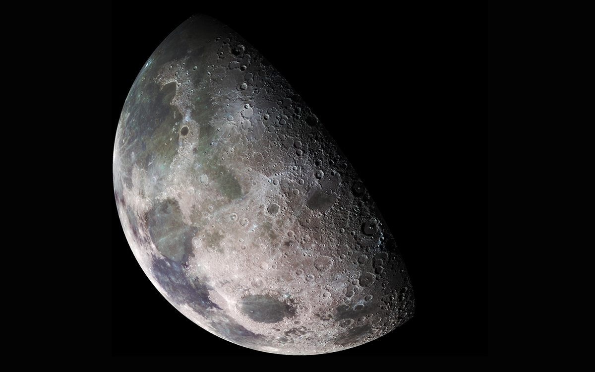 a shadowed moon with high enough resolution to see its craters and various shades of gray