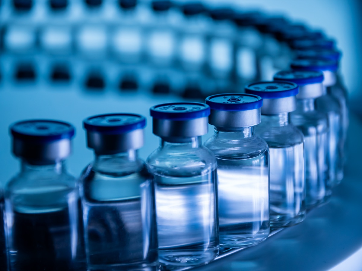 group of vaccine bottles in a lab