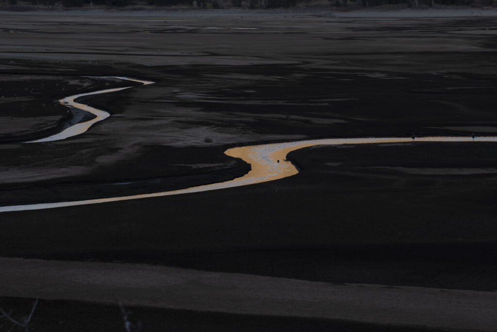 an arial view of a river at dusk