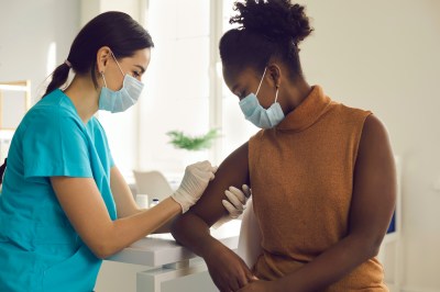 Woman being vaccinated.