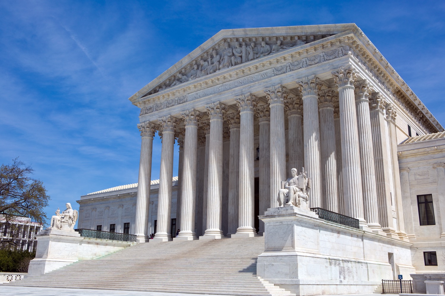 the supreme court from the side, set against a blue sky