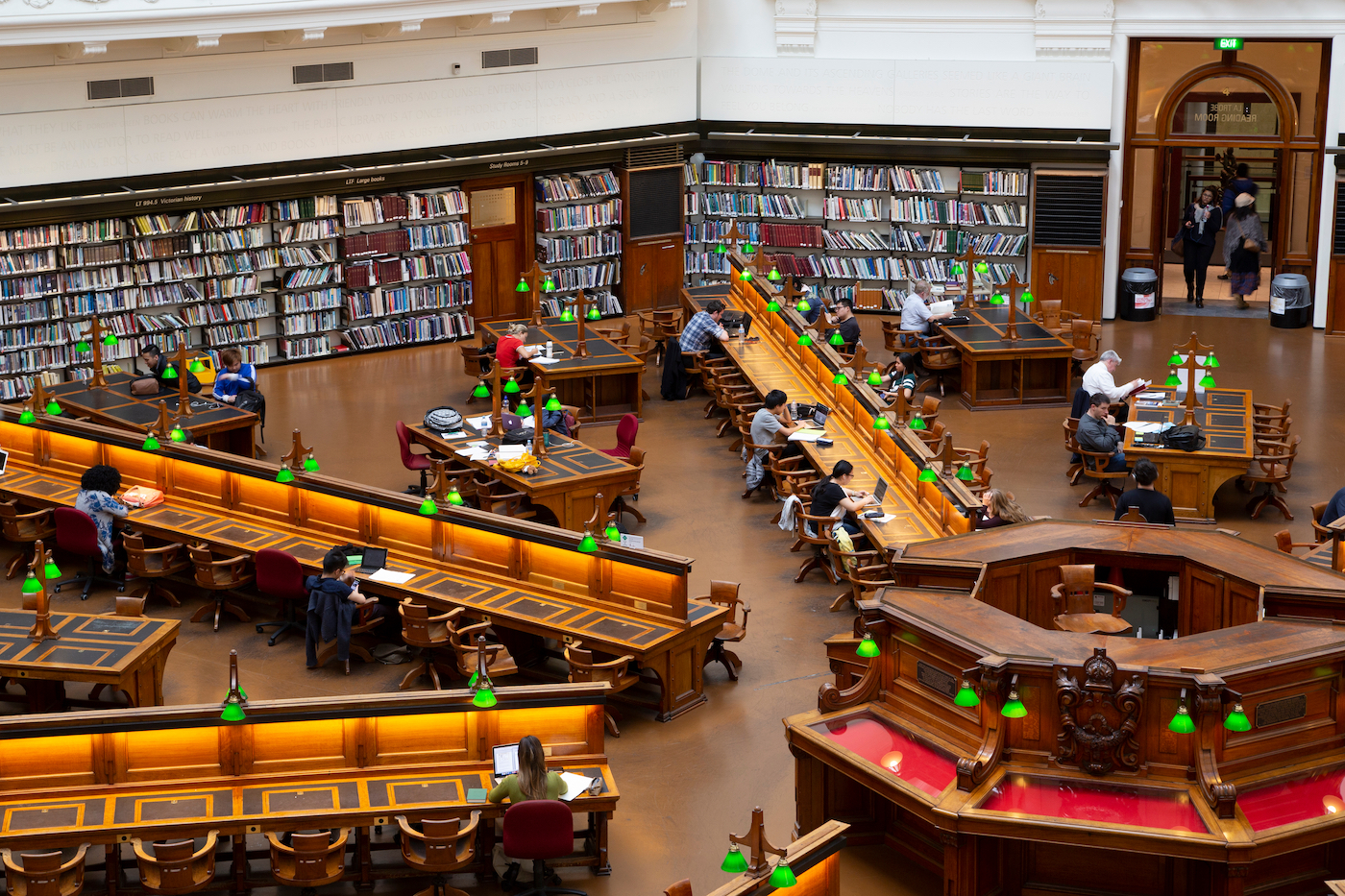 a bird's eye view of a bustling, large public college library.