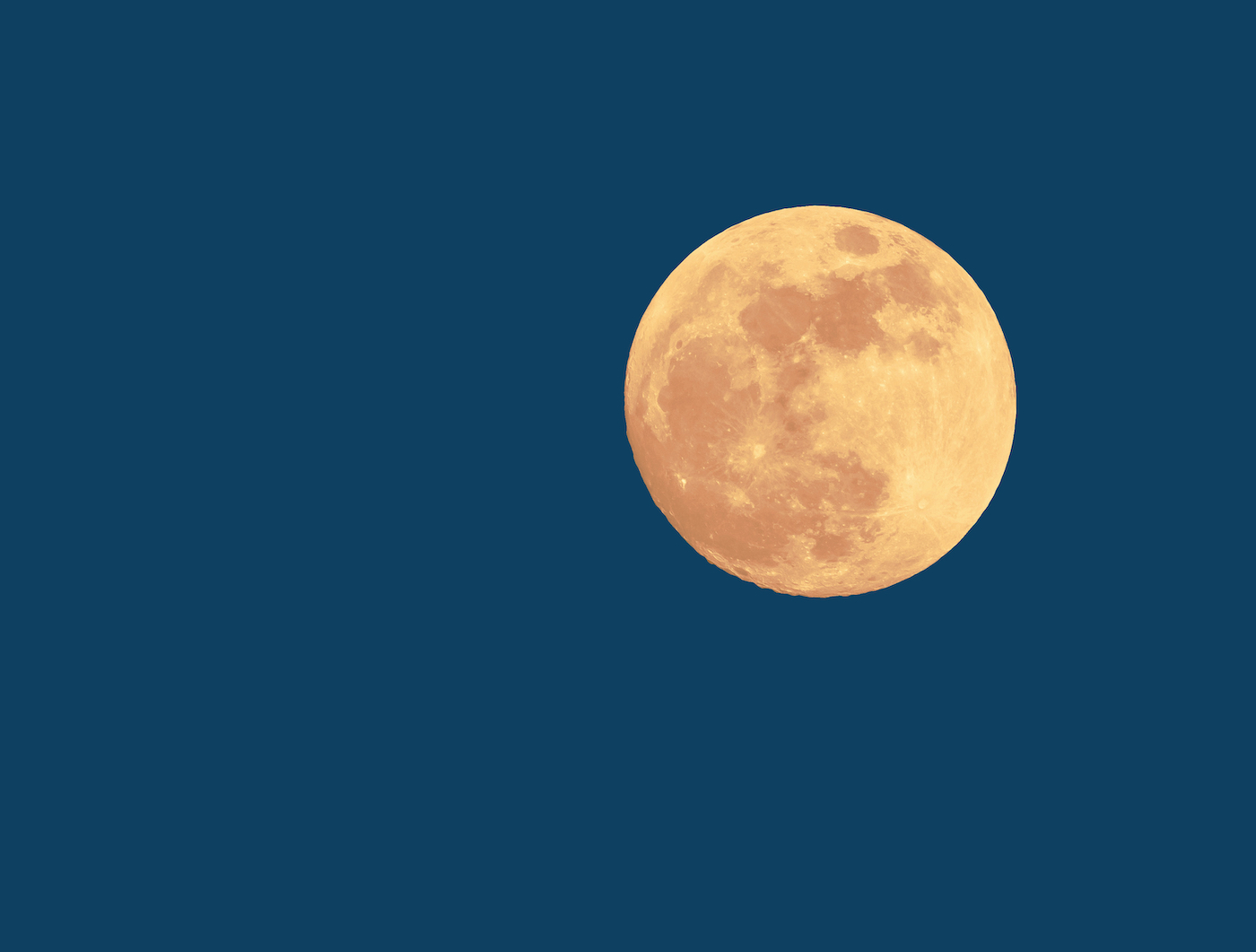 the full moon on a night-blue background