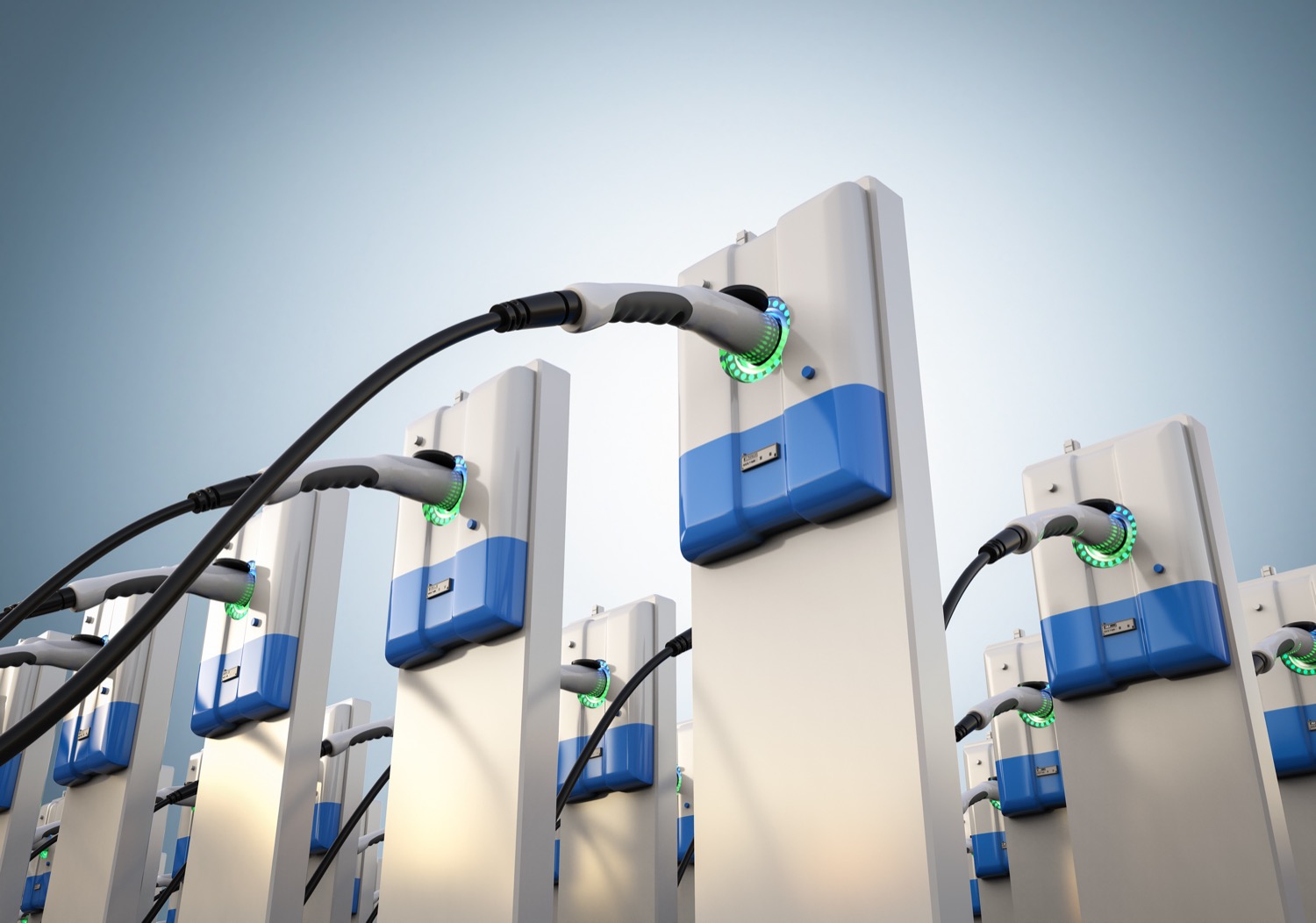 a 3d photo-real rendering of a dozen or so electric vehicle chargers, placed in three rows