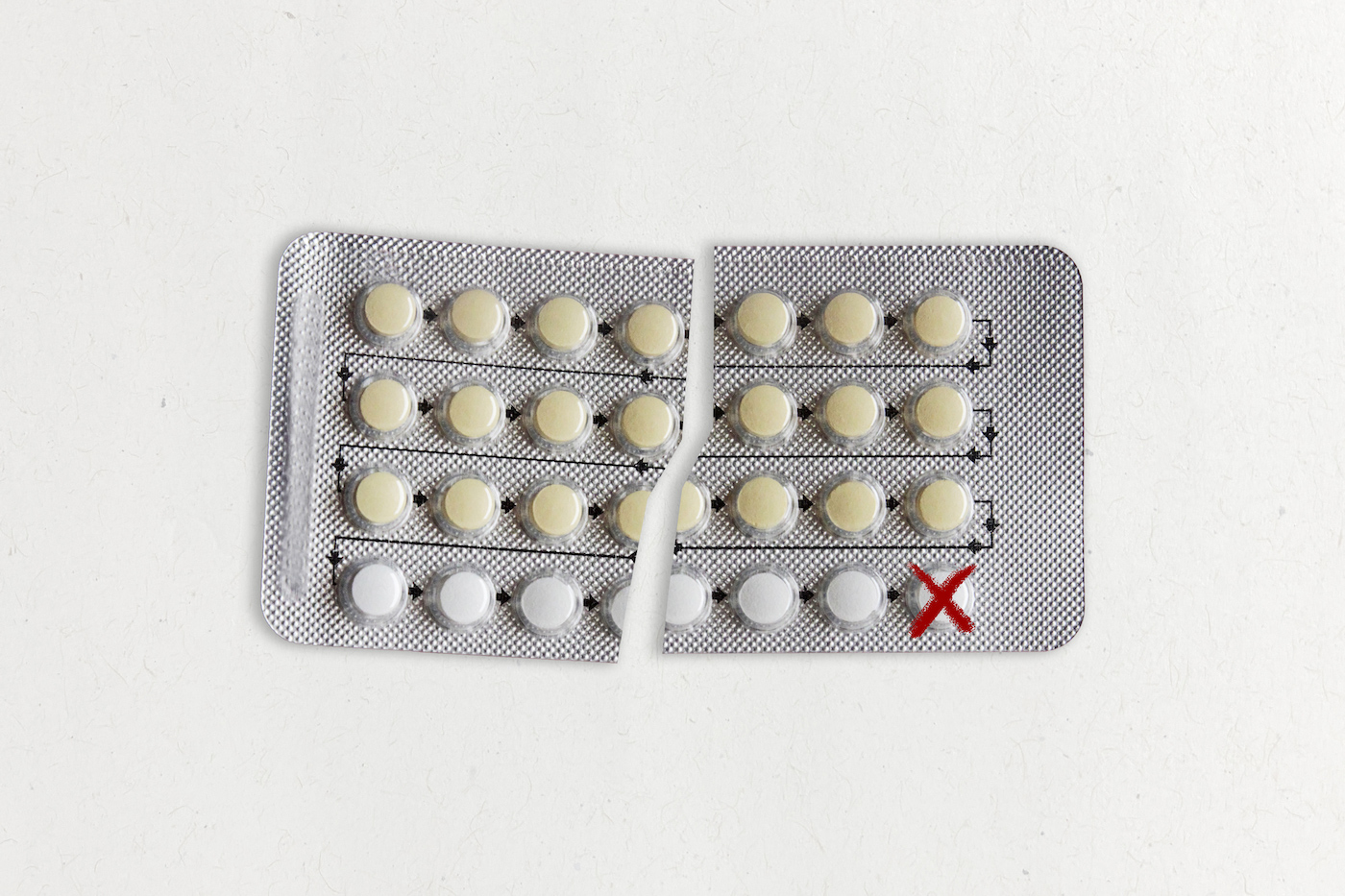 An illustration shows a blister pack of birth control pills torn in half. A red X mark is drawn over the last pill in the pack.