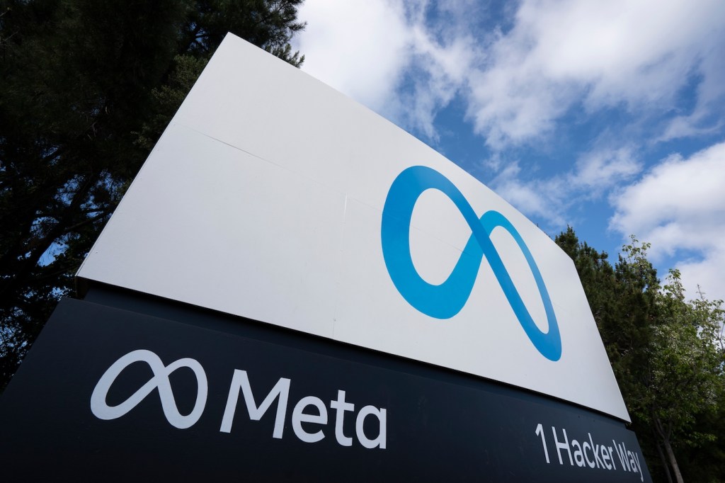 Menlo Park, CA, USA - Apr 30, 2022: Closeup of the Meta sign at the entrance to the Meta Platforms headquarters in Menlo Park, California. Meta Platforms, Inc. is an American tech conglomerate.