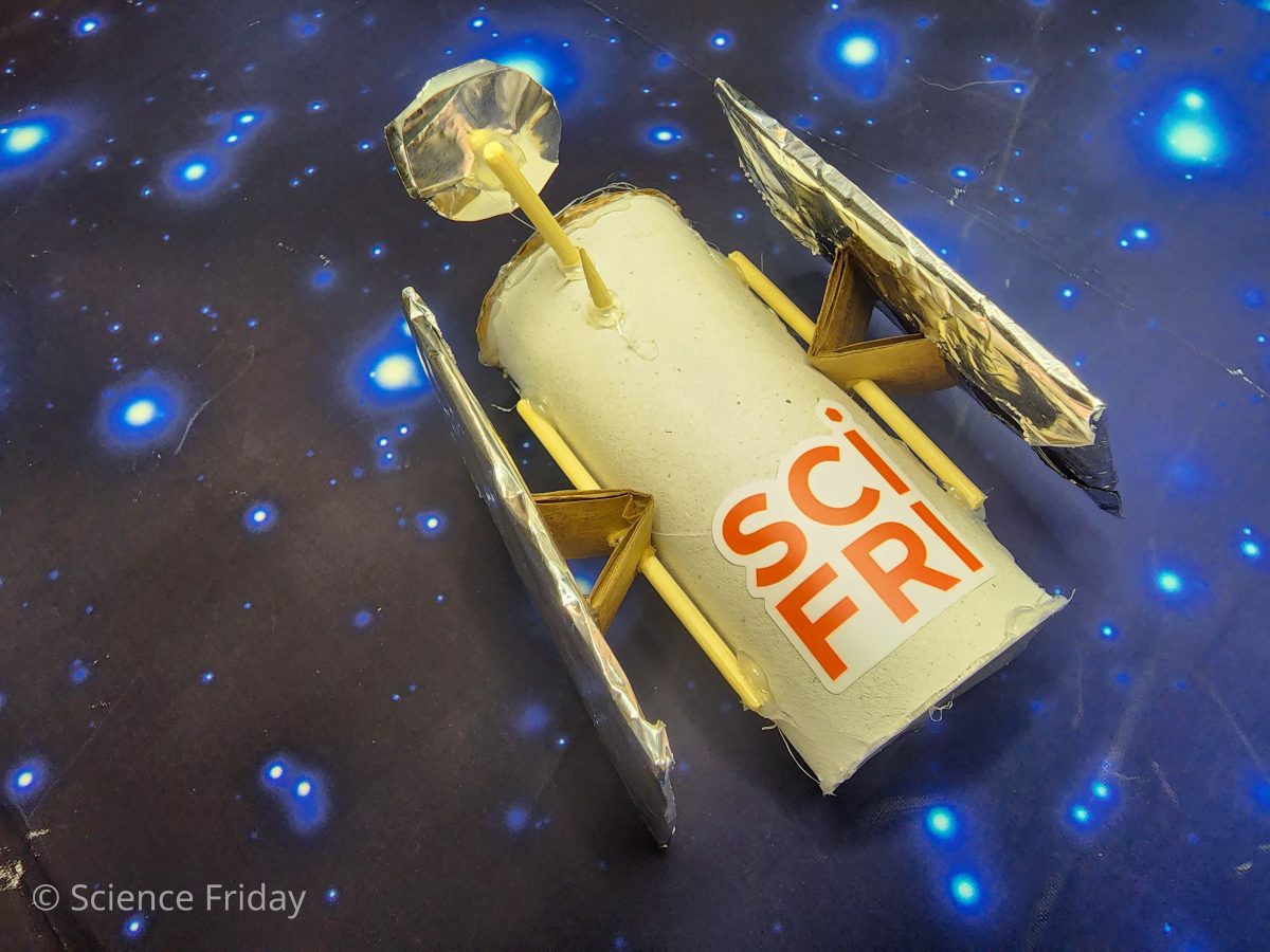 A space probe prototype made wiht a cardboard tube and other household items.