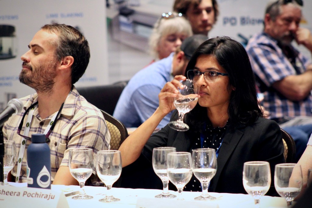 A woman taste testing water. Credit: Alex Hager, KUNC