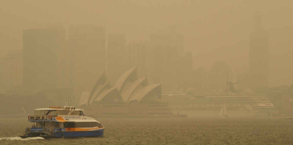 Sydney opera house in Sydney, Australia under a thick cloud of smoke and ash from bushfire pollution. 