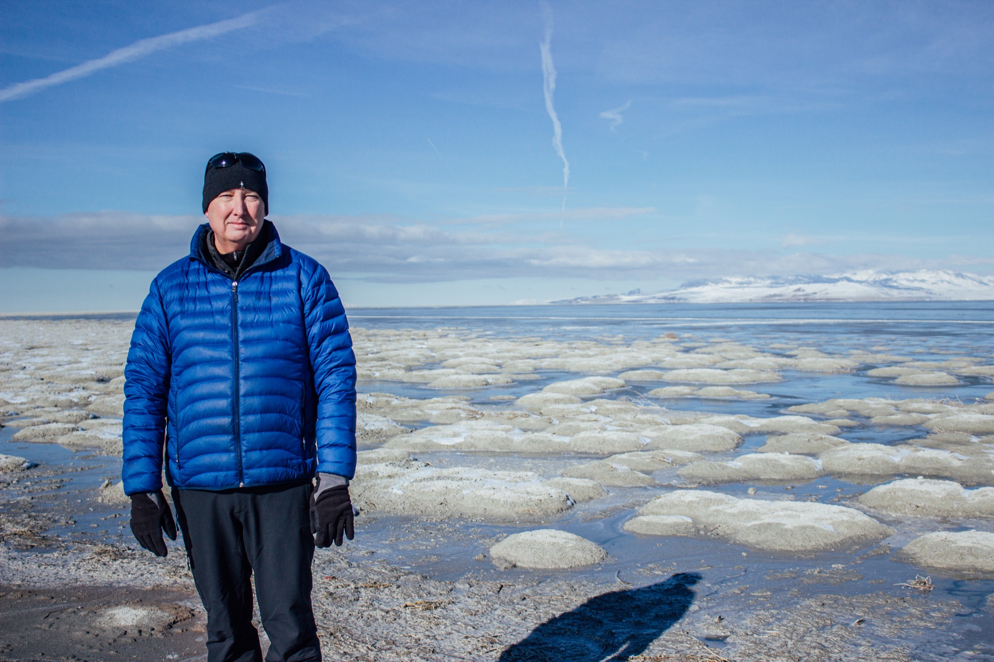 Kevin Perry at the great salt lake in front of dried microbialite communities, Utah