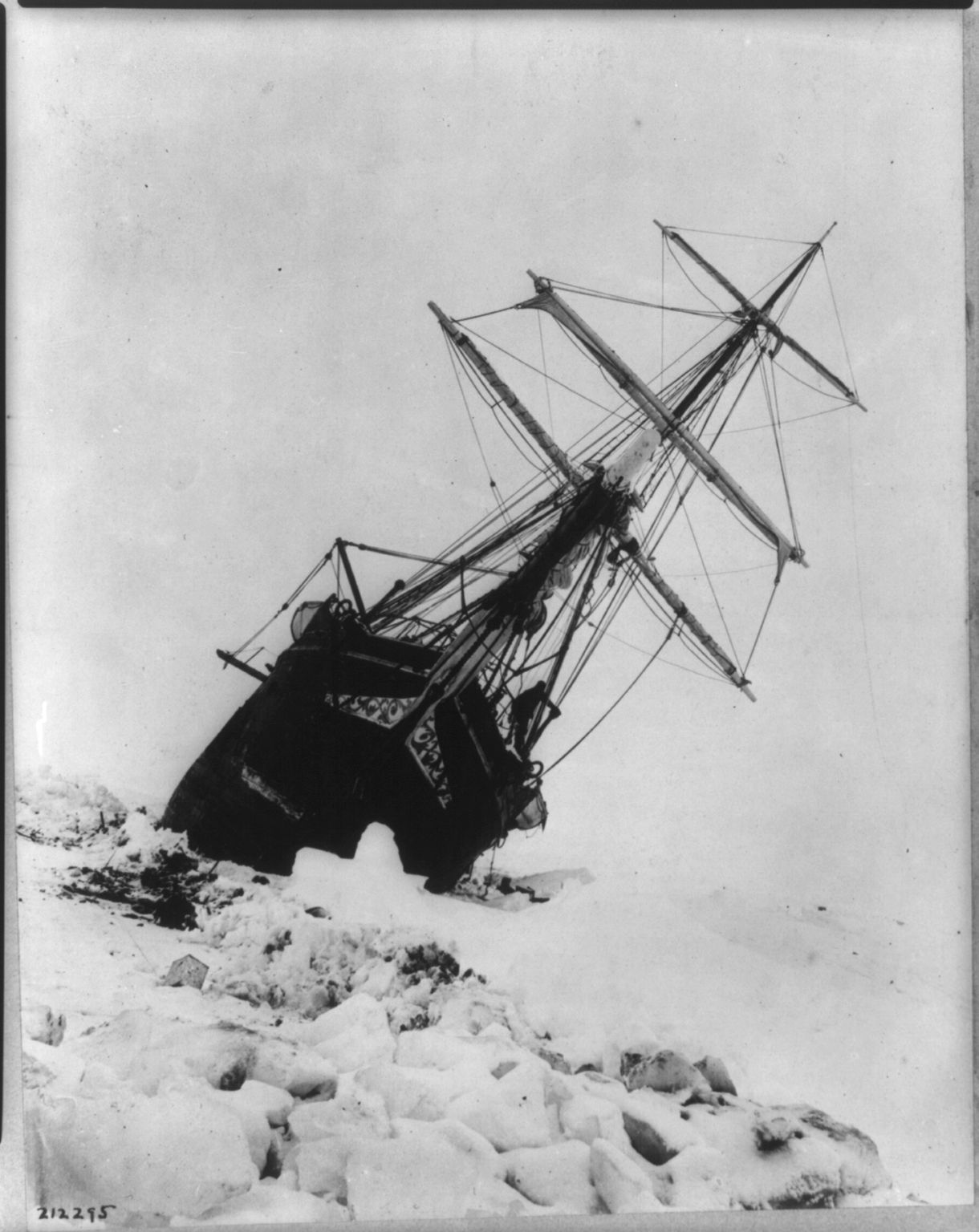 Photograph shows the Endurace, leaning to the right, stuck within an ice jam.
