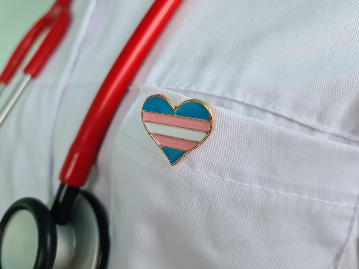Transgender LGBT symbol stethoscope with trans pride icon for rights and gender equality. Medical care insurance and doctor