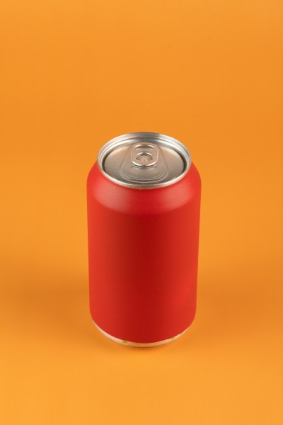 red aluminum can isolated on orange background