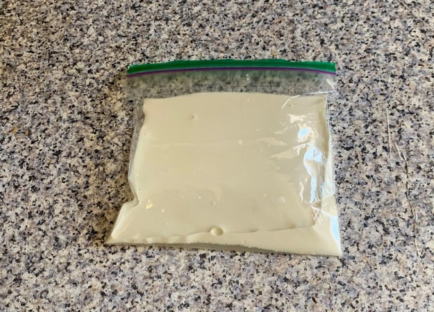 A Ziploc bag with the ice cream ingredients in it.