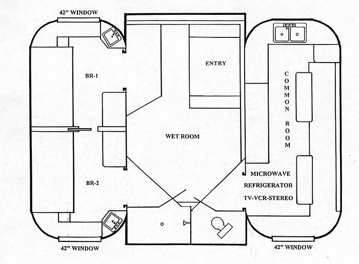 a floor plan layout of an underwater living space. it's got three main chambers. in the center is the entry that leads into the wet room. the the right is the common room with kitchen equipment, tv, and furniture. on the left are two bedrooms