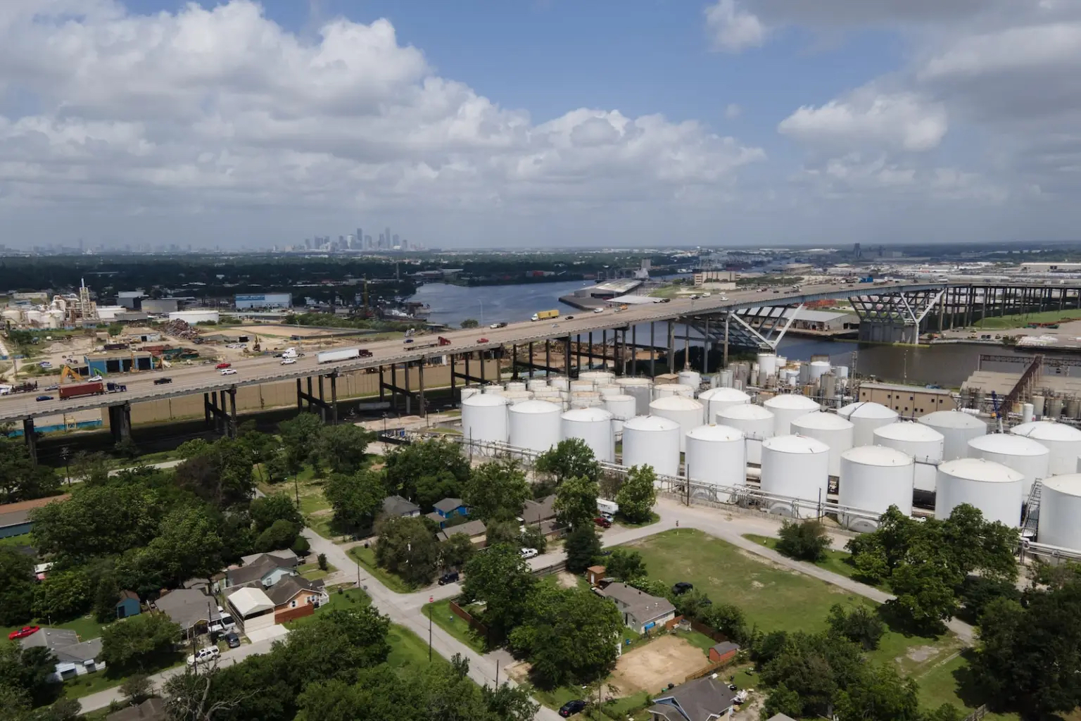 Huge white barrel-shaped buildings live amongst houses and streets in Texas.