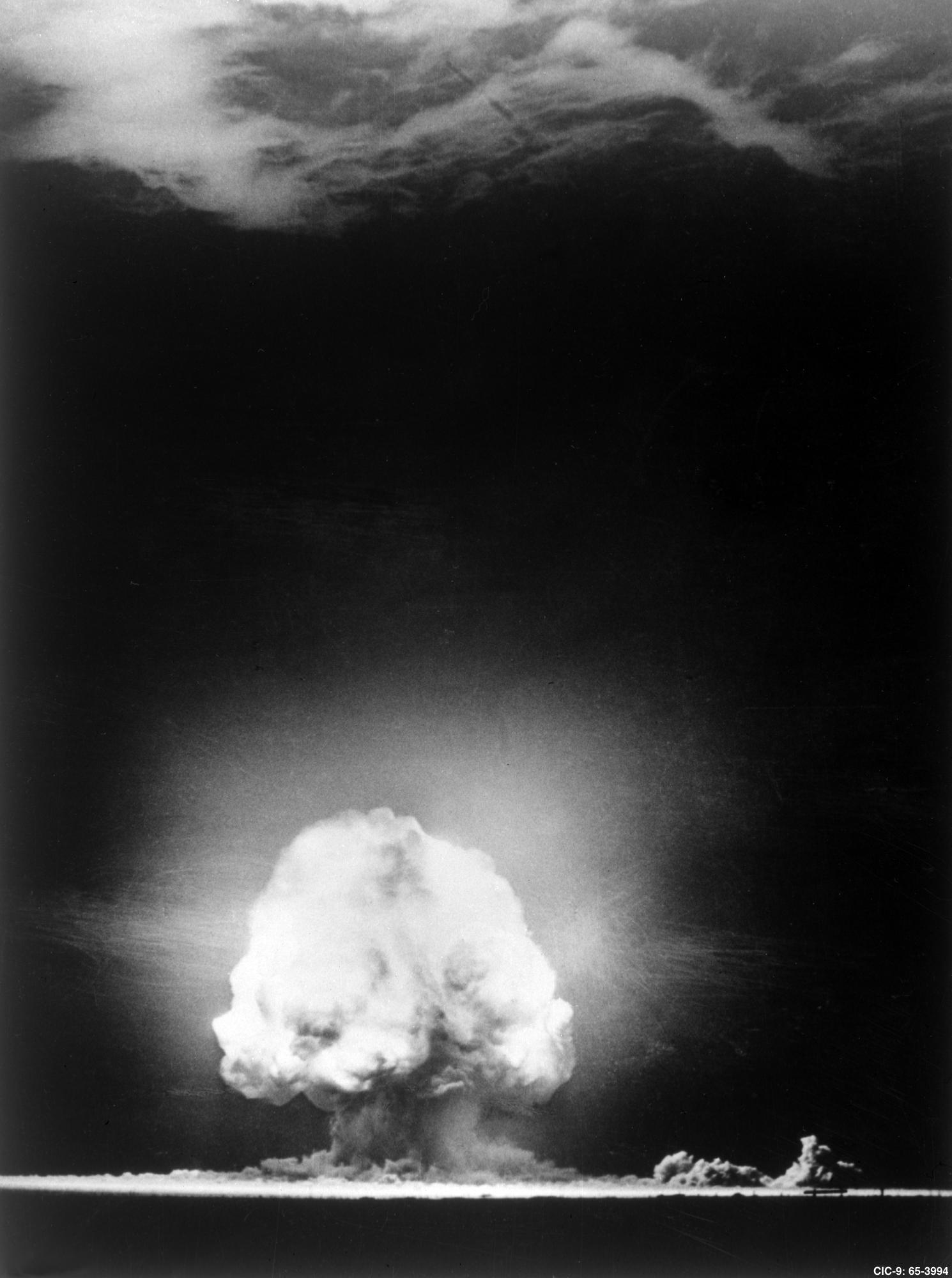a black and white image of a mushroom cloud of a nuclear bomb test