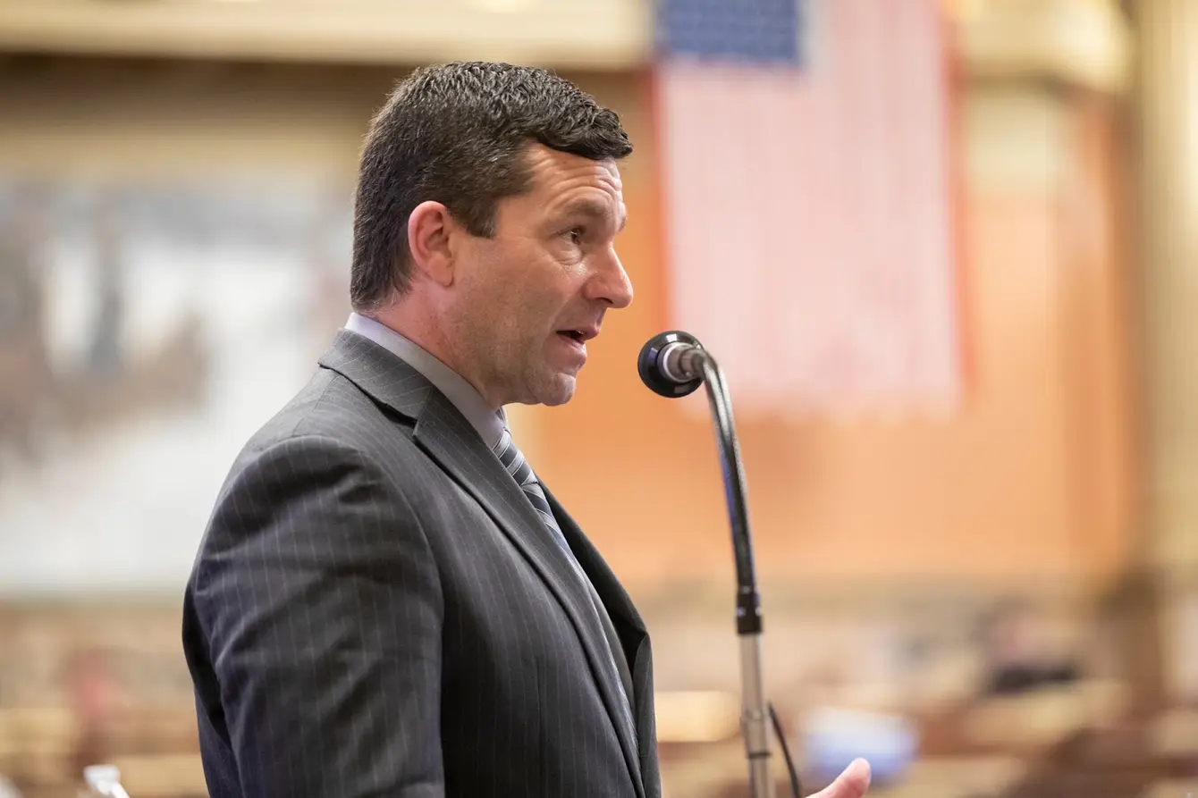 A man speaks into a microphone.