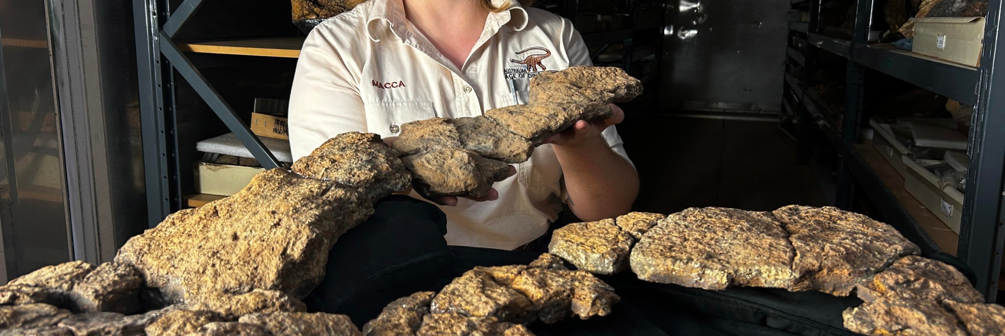 A woman holding a bunch of things that look like rocks