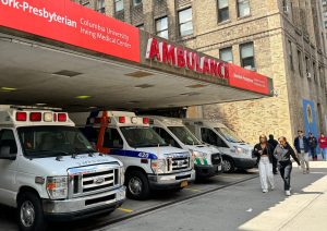Ambulances parked at a hospital in NYC. Public health, CDC gaps.