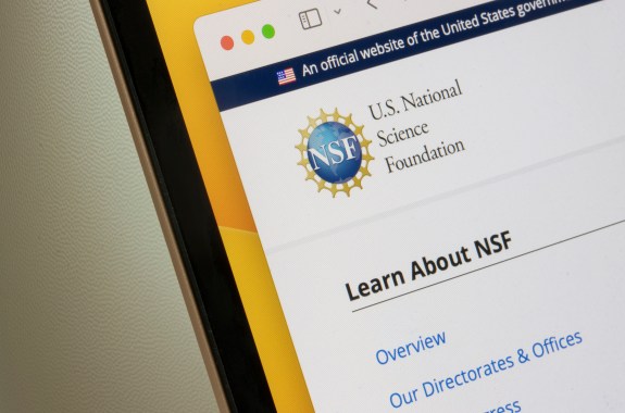 The corner of a laptop screen shows the logo on the website of the National Science Foundation