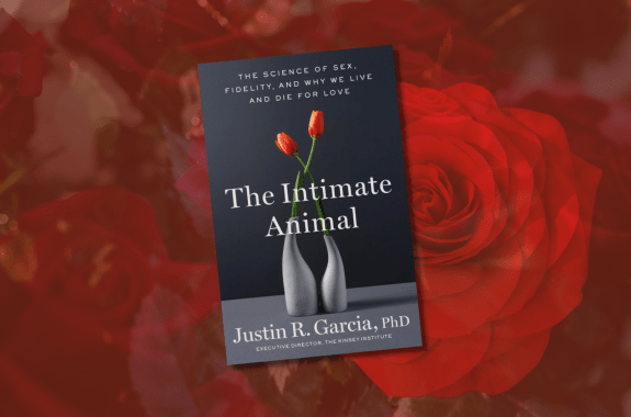 "The Intimate Animal," a book by Justin Garcia, overlaid on a background of red roses.