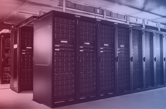 Rows of black metal data-processing units in a bare room.