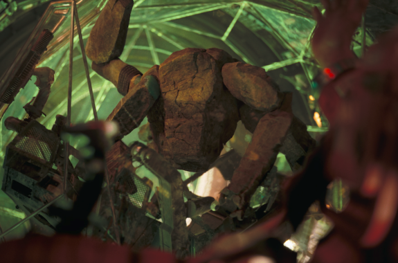 An alien that looks like a tarantula made of rocks against a greenish background