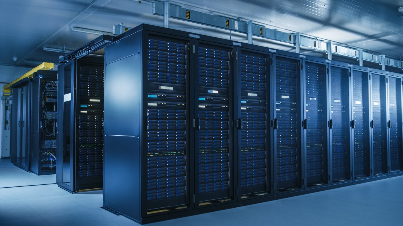Shot of Modern Data Center With Multiple Rows of Operational Server Racks.
