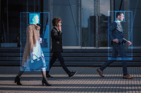 Crowd of Business People Tracked with Advanced Technology Walking on Busy Urban City Streets.