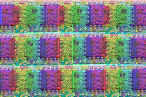 A repeating pattern of a photograph of a silicon chip, recoloured so that it is multi-coloured, in the style of pop art.