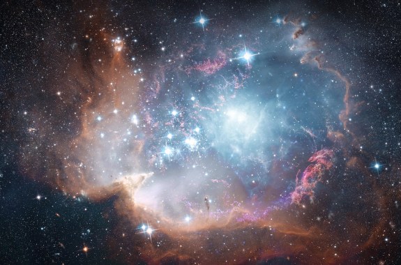 A view from space to bright white galaxy filled with stars and nebulae.