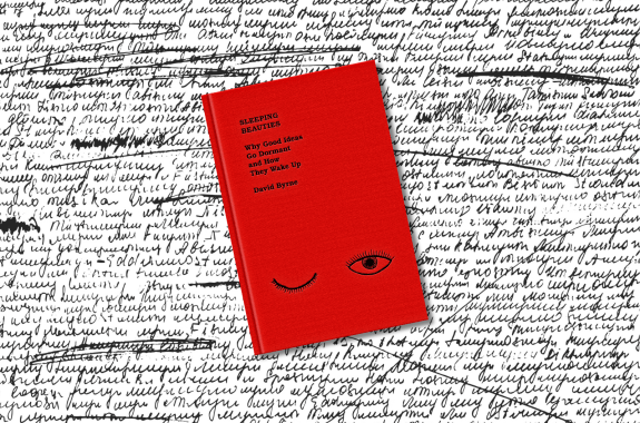 A red book cover set against a background of scribbled text